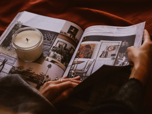 ma magazine and a candle